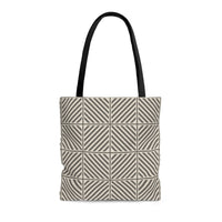 Photo of a neutral colored tote bag with a pattern of intersecting and repeating lines. This neutral tote is in colors of  griege, tan and stone brown.
