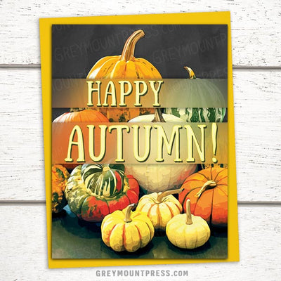 Fall Themed Greeting card featuring a variety of pumpkins and the message Happy Autumn. Autumn greeting card.