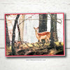 Product photo of a non-denominational holiday card box set. This Hygge Christmas card featuring a deer pausing before a forest clearing, while the first winter snowflakes fall all around.