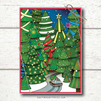 Photo shows a Whimsical Holiday card with a wood paneled station wagon driving a fully decorated tree through a forest of lit trees.