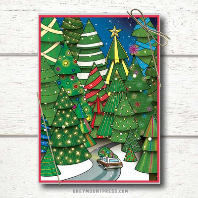 Photo shows a Whimsical Holiday card with a wood paneled station wagon driving a fully decorated tree through a forest of lit trees.