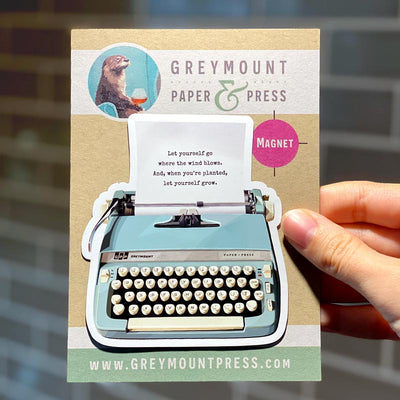 Vintage typewriter refrigerator magnet. This is a fridge magnet featuring a design with a vintage teal typewriter, with an inspirational poem on the paper.