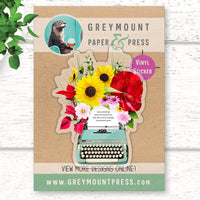Clear vinyl stickers with a vintage typewriter design with flowers bursting from the page. Vintage typewriter laptop sticker.